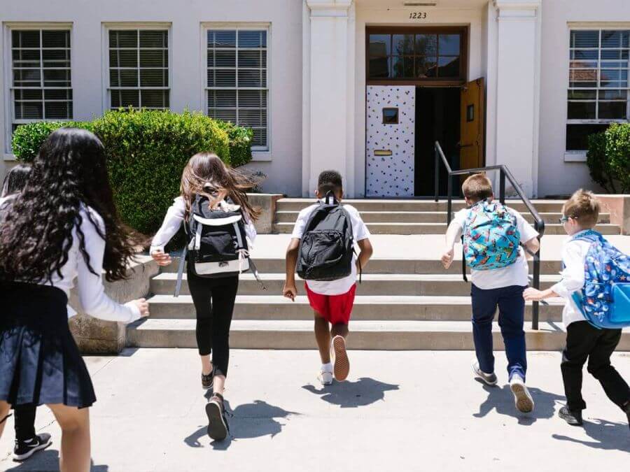 K-12 students arriving at school in the morning